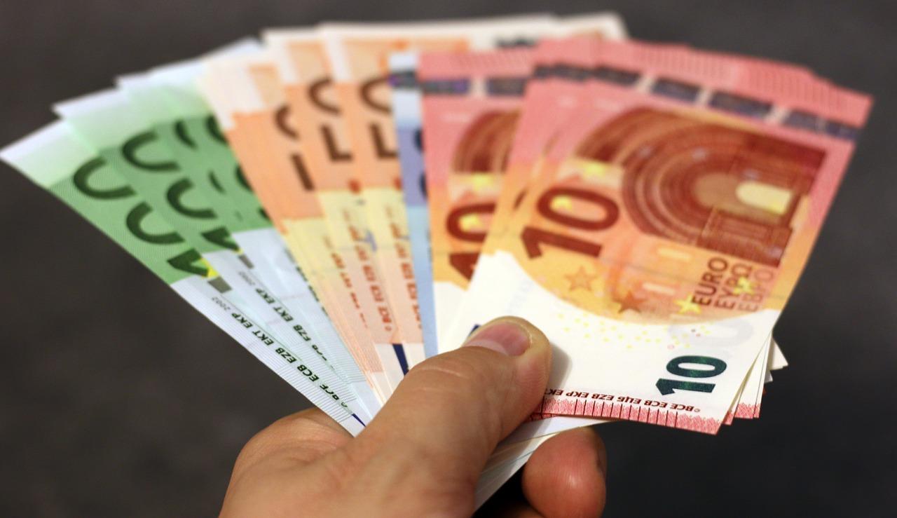 Euro notes in a man's hand