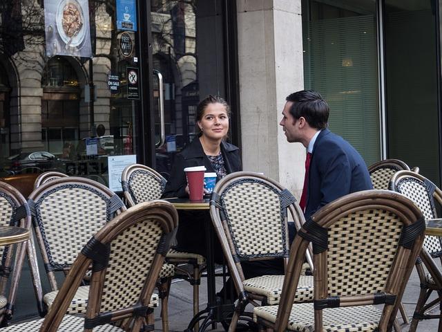 Guy talking to a girl in a cafe