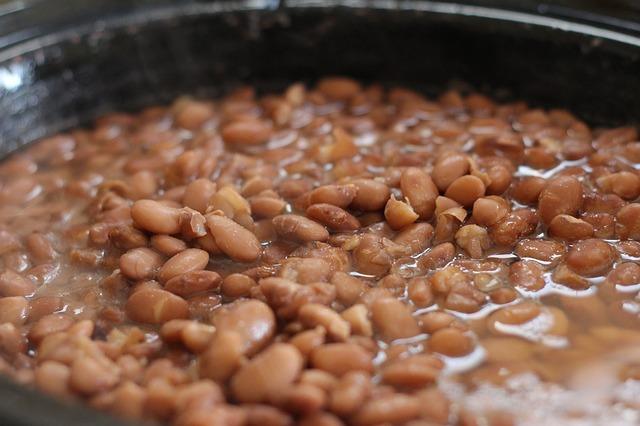 Beans are stewed in a pan