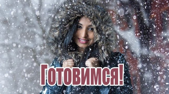 Girl in a jacket under the snow